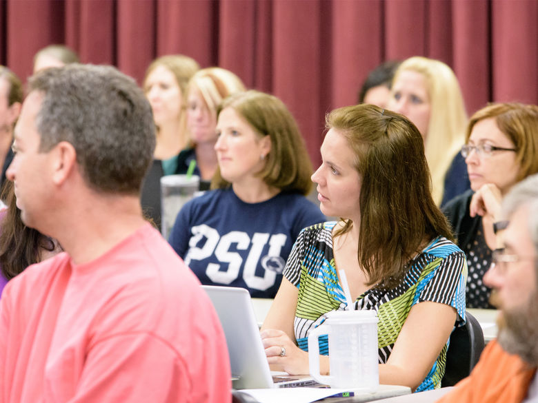 Students listening during a graduate Summer Institute program.