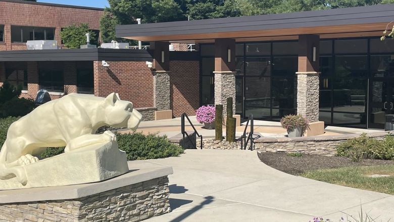 Lion Shrine statue infront of a classroom building