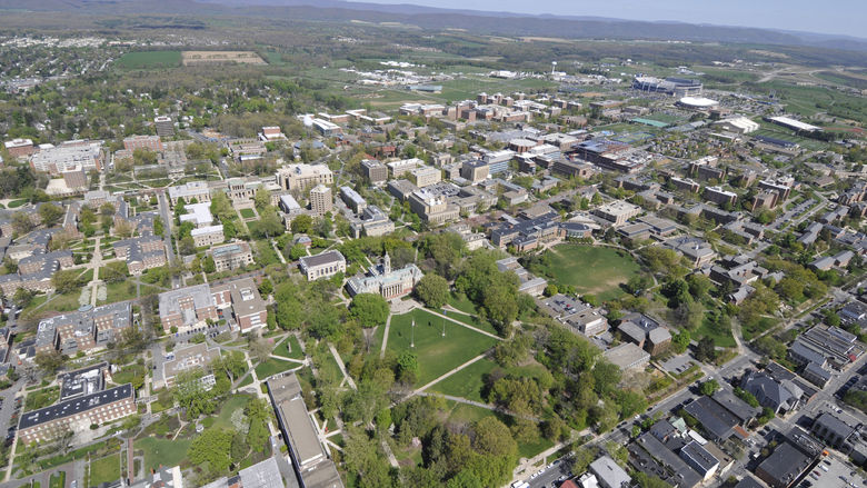 An aerial view over Penn State's University Park campus and State College