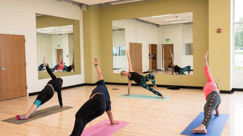 Students taking a yoga class.