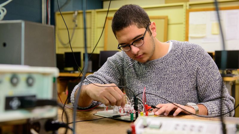Engineering Student Mohamed El Sonbaty working with electronics in the lab