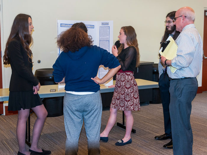 Students presenting their research at the Cognitive Psychology Research Fair hosted on campus.