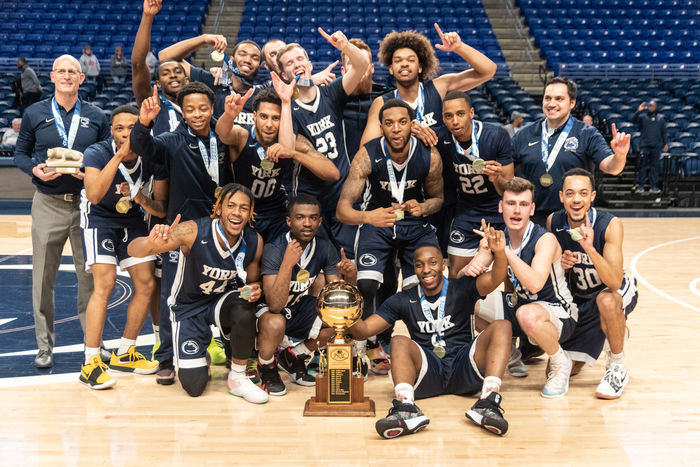 Penn State York Men’s Basketball Celebrates with the 2019 PSUAC Championship trophy