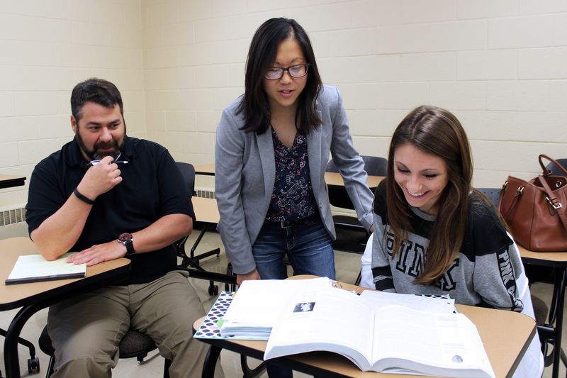 Nicole Muscanell and students in a classroom.