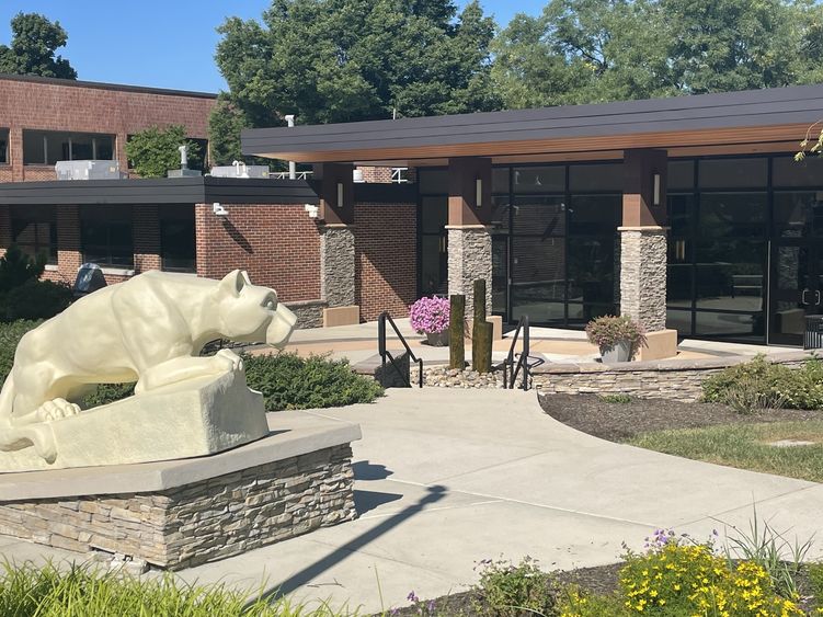 Lion Shrine statue infront of a classroom building