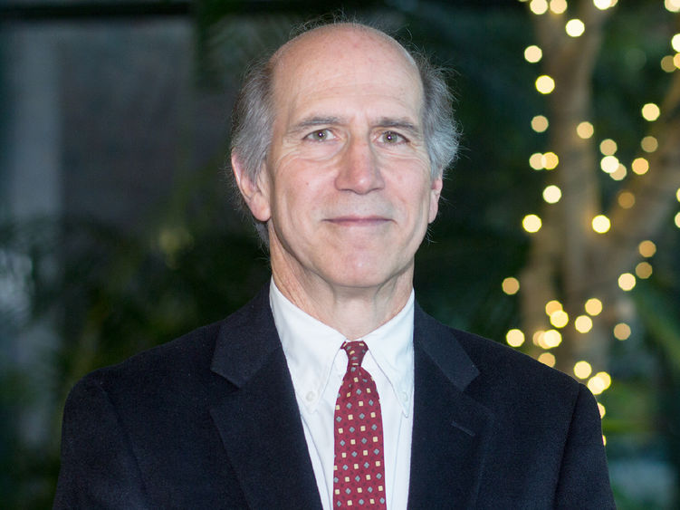 Older white male dressed in a suit and tie