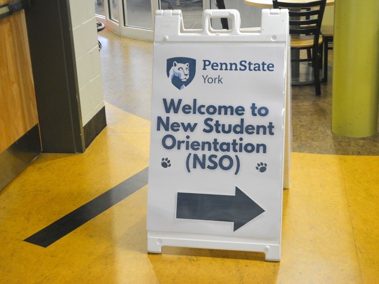 Sandwich board sign with Penn State York logo, welcoming new students.